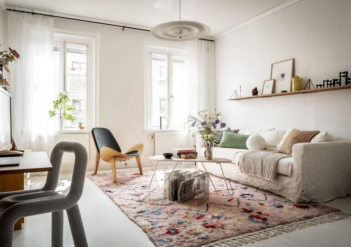 bright living room with pastel colored rug nordroom