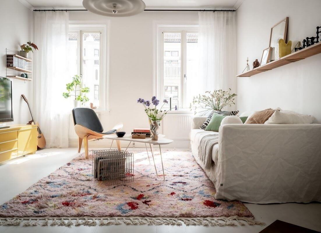 bright scandi living room with large pastel rug nordroom