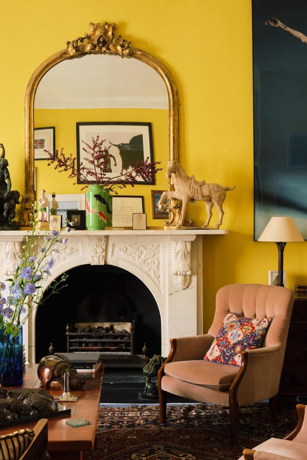 The Color Trends for 2025: Warm, Natural Shades and a Cheerful Accent 57 bright yellow living room in period home with fireplace and gilded mirror nordroom