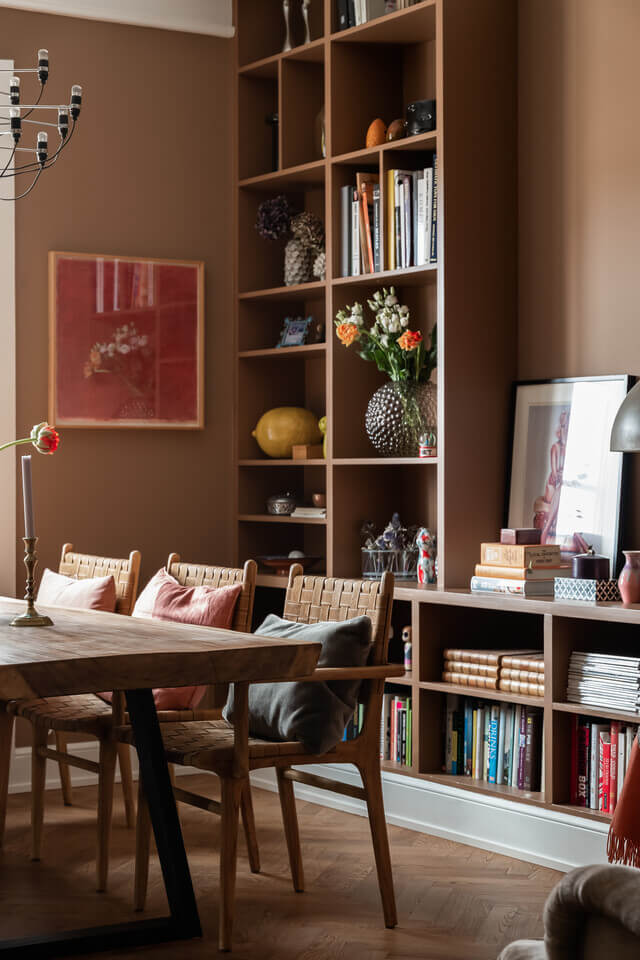 The Color Trends for 2025: Warm, Natural Shades and a Cheerful Accent 88 brown-dining-room-built-in-bookcases-scandinavian-design-nordroom