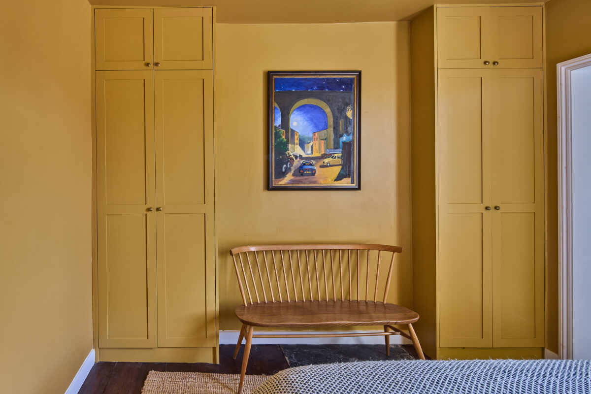 A 19th Century London Cottage with a Stunning Kitchen Extension 19 built-in wardrobes yellow bedroom