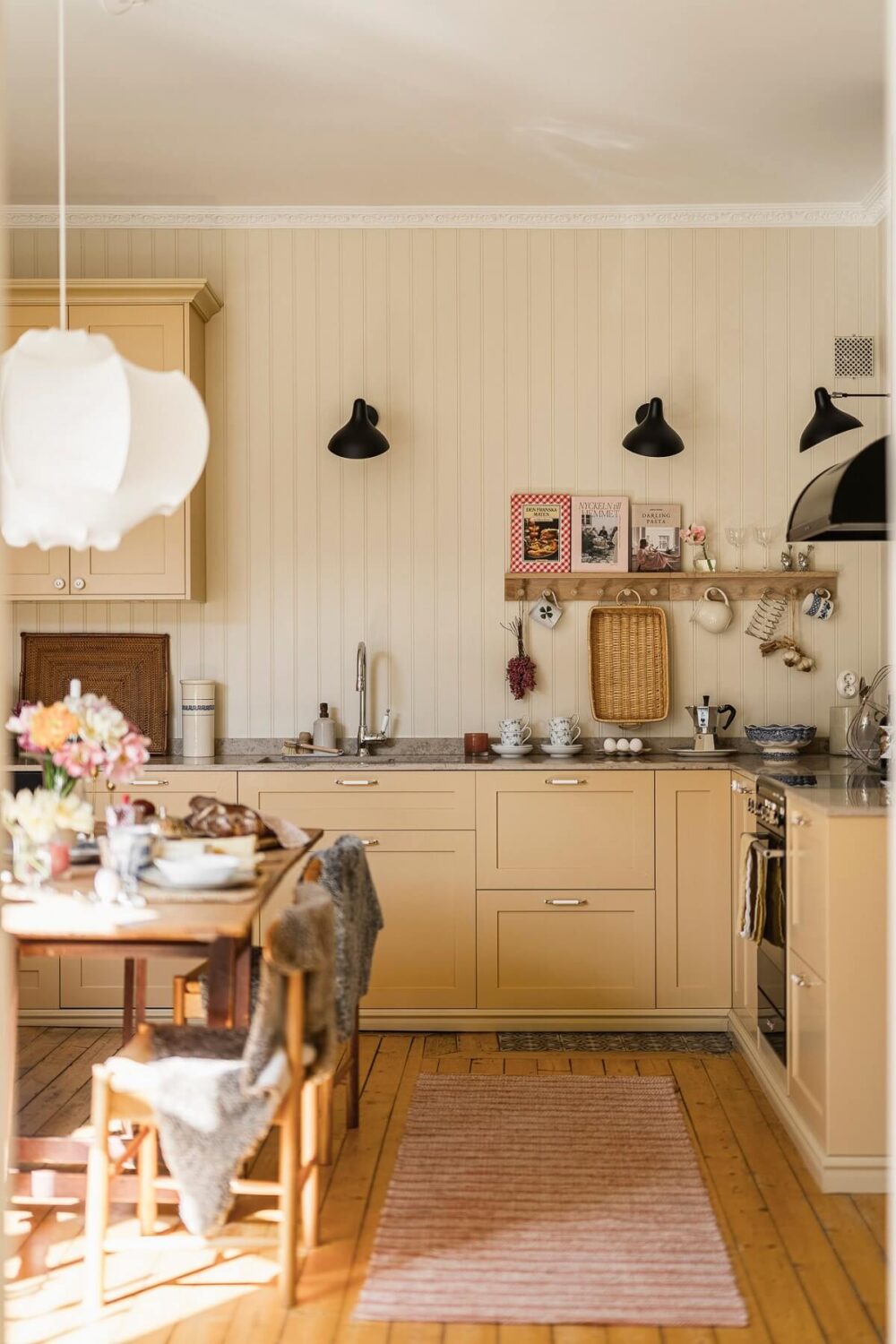 The Color Trends for 2025: Warm, Natural Shades and a Cheerful Accent 64 butter yellow kitchen cabinets wooden walls painted in sans by jotun nordroom