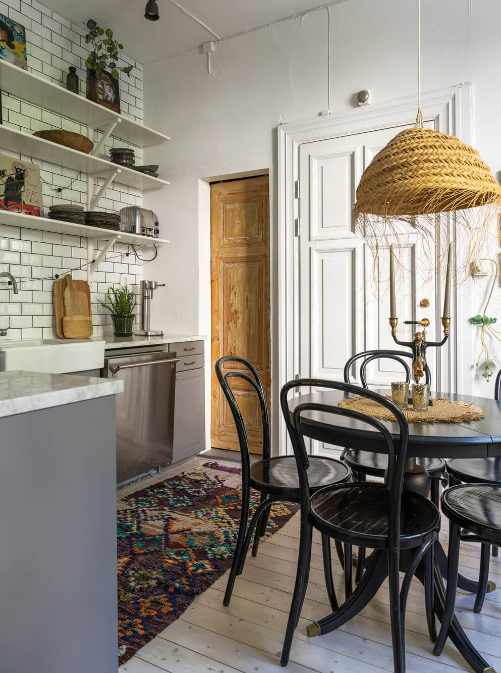 Classic Proportions and a Charming Kitchen in a Malmö Apartment 4 charming kitchen gray cabinets shelves and round wooden table
