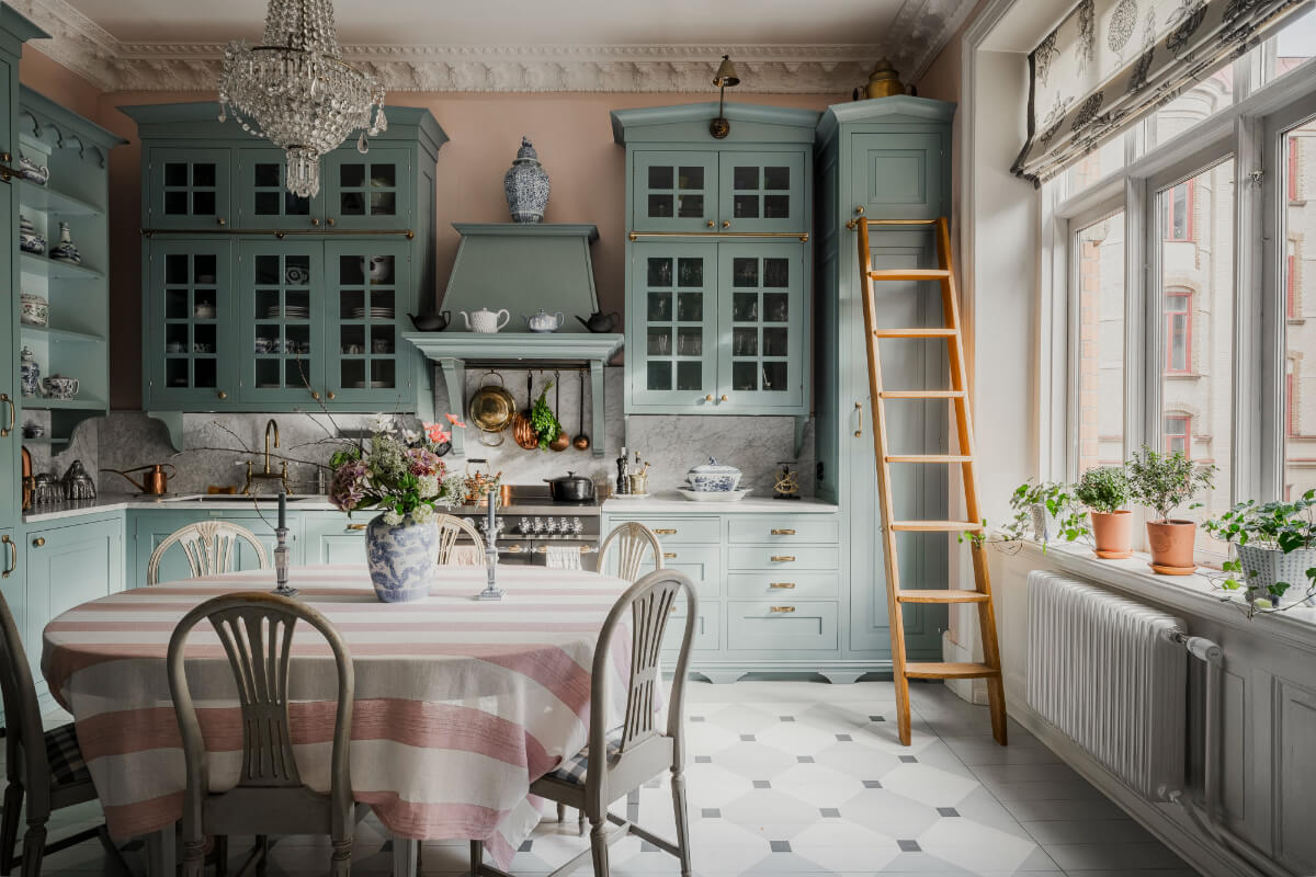 Behr Color of the Year 2026: Hidden Gem 24 classic kitchen blue cabinets pink walls dining table