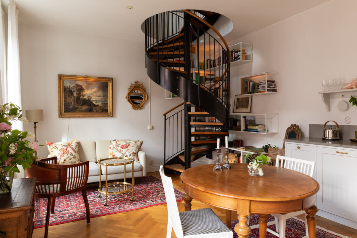 classic open plan living space spiral staircase
