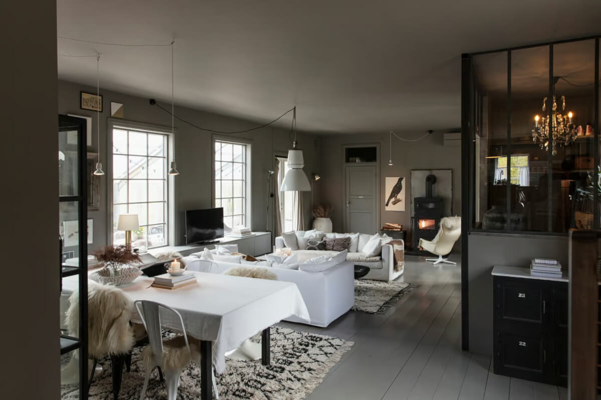 An Open-Plan Gray Home in a Former Textile Factory 1 color drenched gray living space white sofas