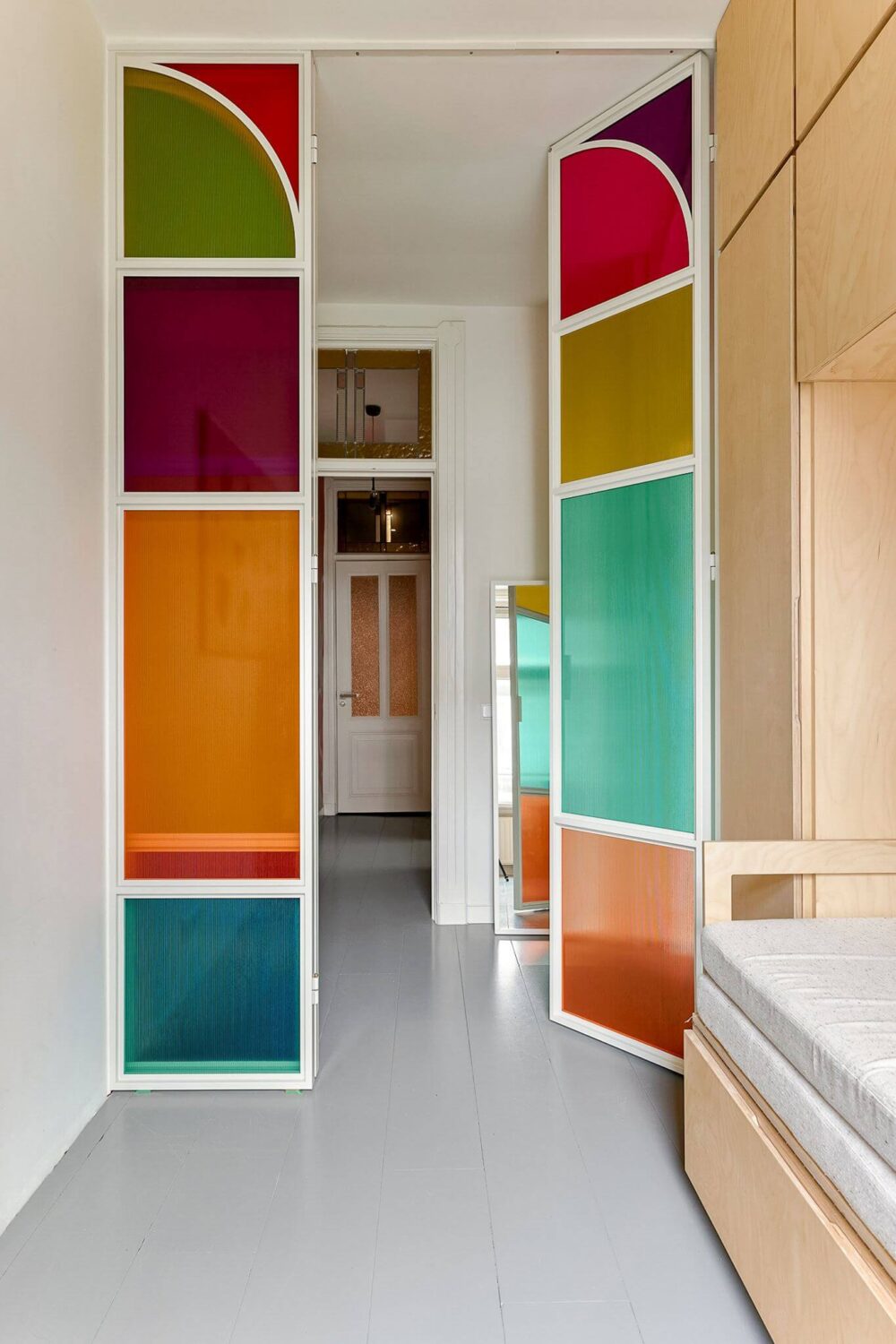 An Amsterdam Apartment with Surprising Bold Color Accents 17 colorful glass doors