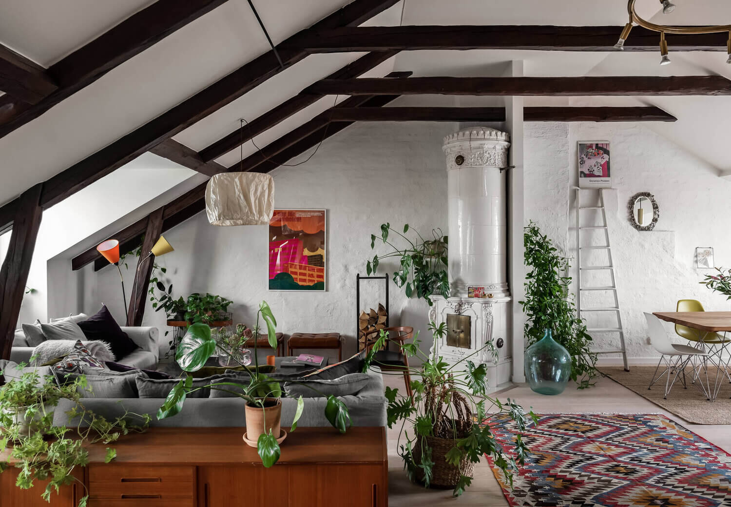 A Scandinavian Penthouse Apartment With A Dark Green Kitchen 4 colorful rug penthouse plants scandinavian nordroom A Scandinavian Penthouse Apartment With A Dark Green Kitchen