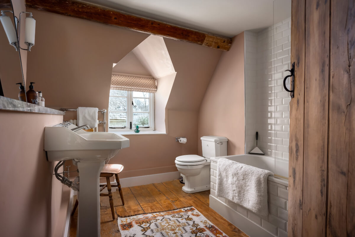 A Charming Cotswold Cottage with a deVOL Kitchen 13 cottage bathroom light pink walls wooden floor