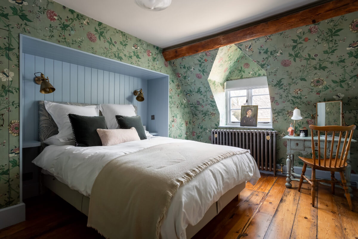 A Charming Cotswold Cottage with a deVOL Kitchen 11 cottage bedroom blue built-in bedframe green wallpaper
