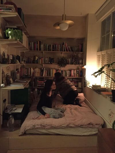 52 Studio Apartments with a Curtain Room Divider 30 cozy-bed-area-bookshelves-nordroom