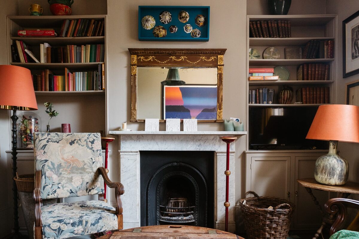 A Cozy Victorian House with Warm Color Accents 3 cozy-living-room-built-in-shelves-nordroom