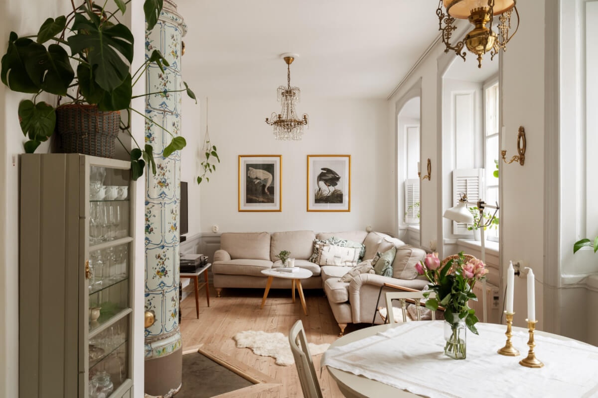 cozy living room large windows painted fireplace