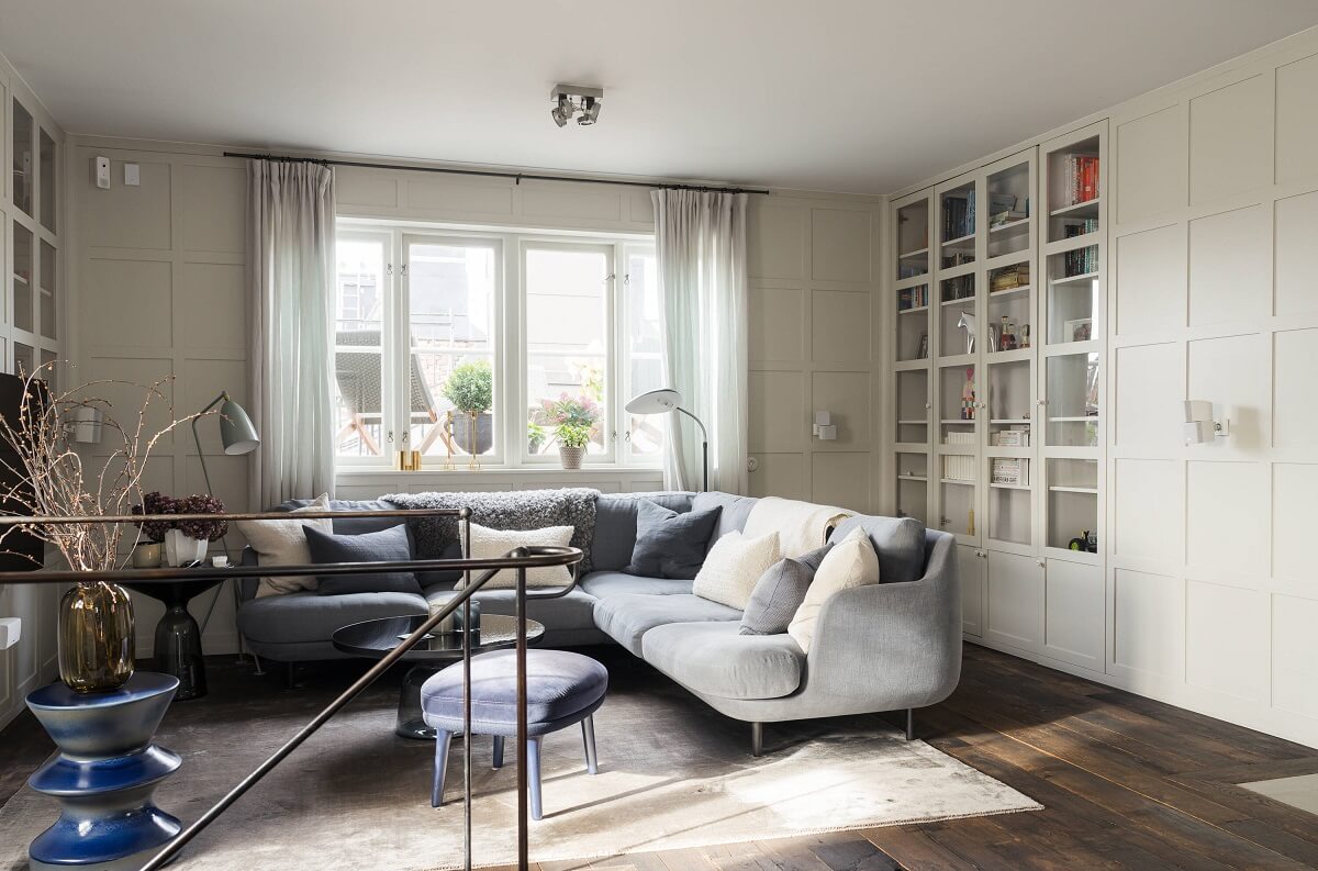 A Stylish Penthouse Apartment with Exposed Beams 17 cozy seating room l shaped sofa