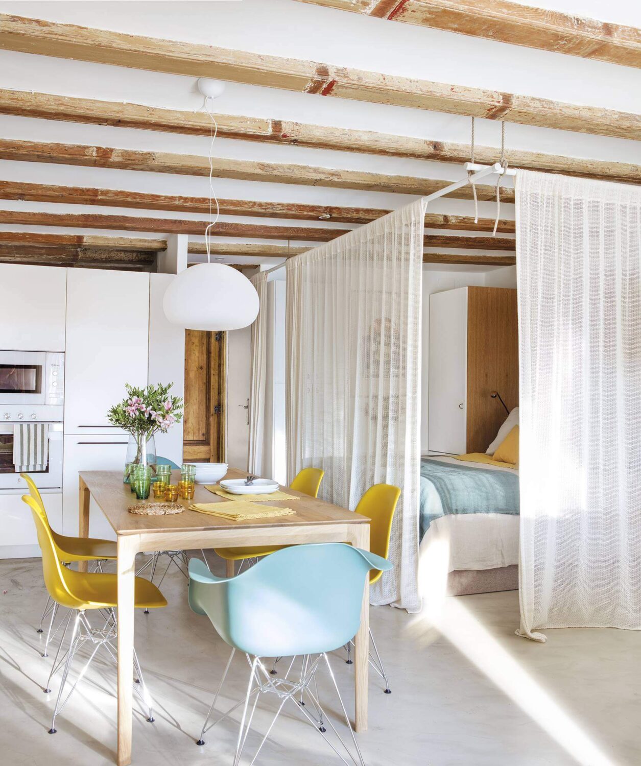 52 Studio Apartments with a Curtain Room Divider 3 curtains-around-bed-light-studio-wooden-beams-nordroom