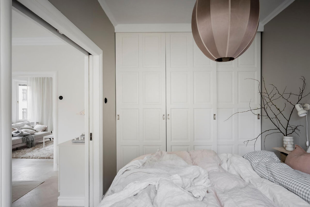 A Light Corner Apartment with an Open Flowing Floor Plan 30 dark beige bedroom wardrobe wall