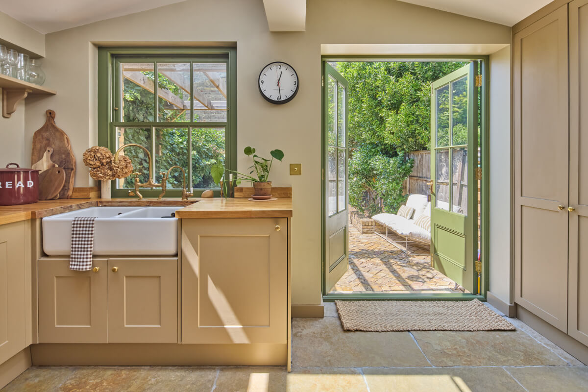 A 19th Century London Cottage with a Stunning Kitchen Extension 8 dark beige kitchen large butler sink brass fittings