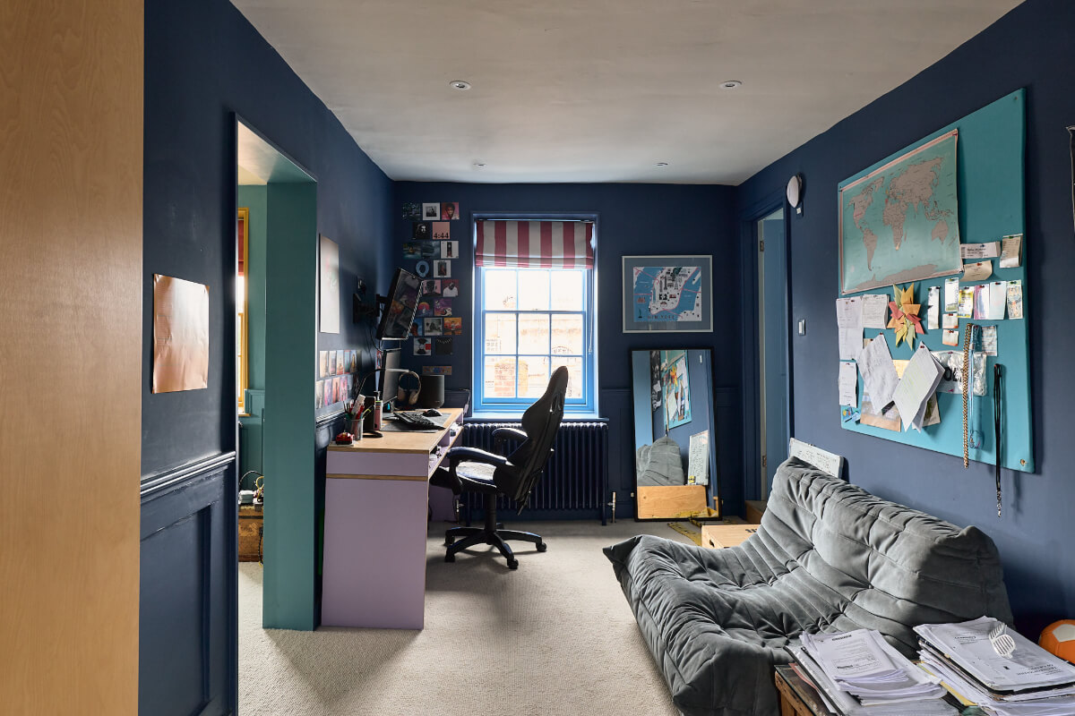 A Colorful Design-Led Georgian House in the Heart of Henley-on-Thames 39 dark blue bedroom with desk and sofa