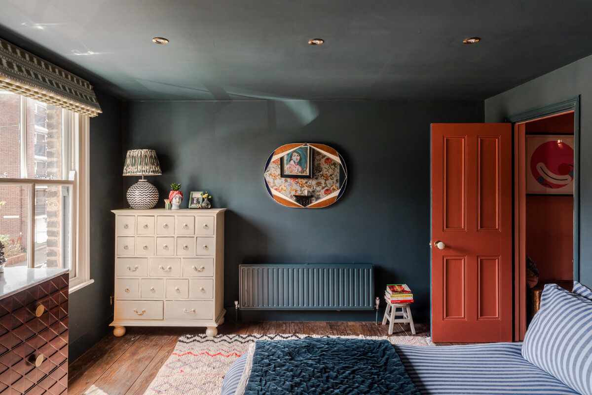 A Victorian Home with a Rich Color Palette and a Beautiful Garden 17 dark blue bedroom