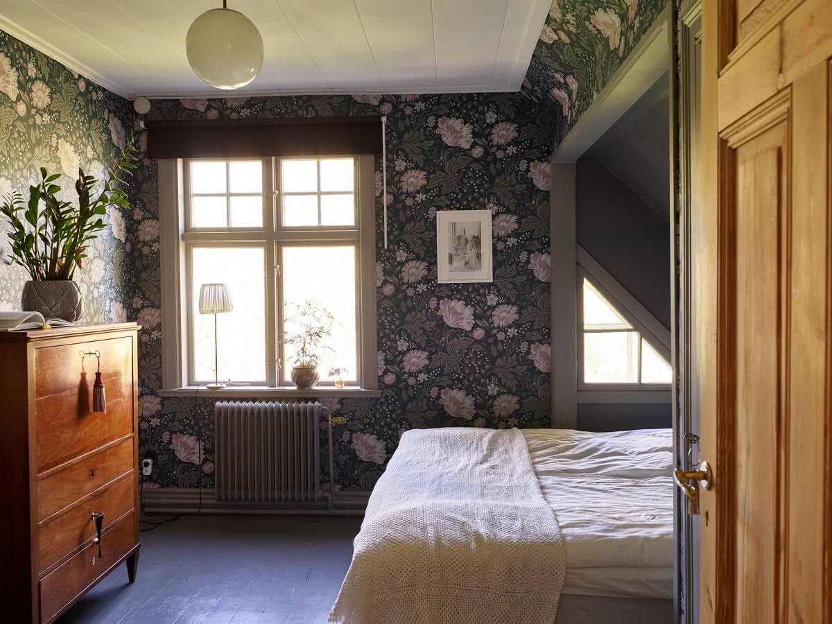 Beautiful Dark Feminine Bedroom Ideas For Every Style 16 dark-floral-wallpaper-bedroom-slanted-ceiling-nordroom