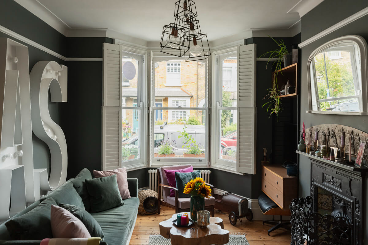 Exposed Brick and Wooden Beams in an Extended London Home 2 dark gray sitting room bay window fireplace