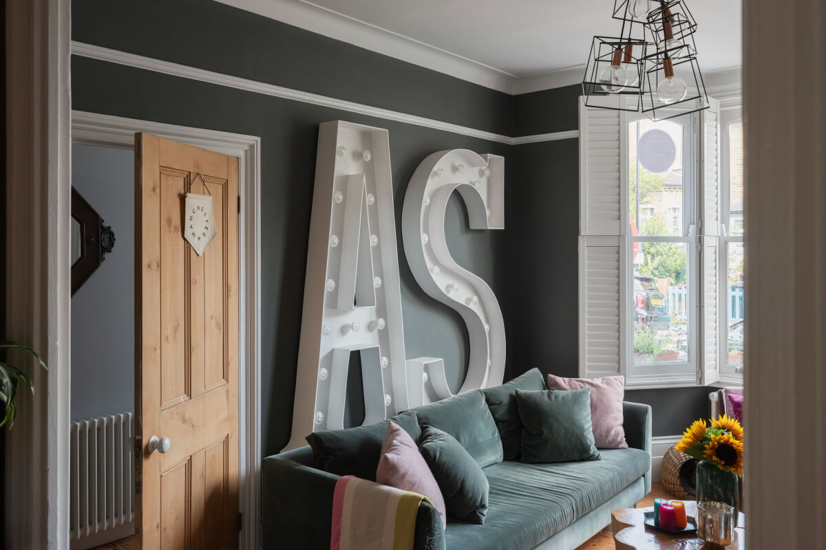 Exposed Brick and Wooden Beams in an Extended London Home 3 dark gray walls living room