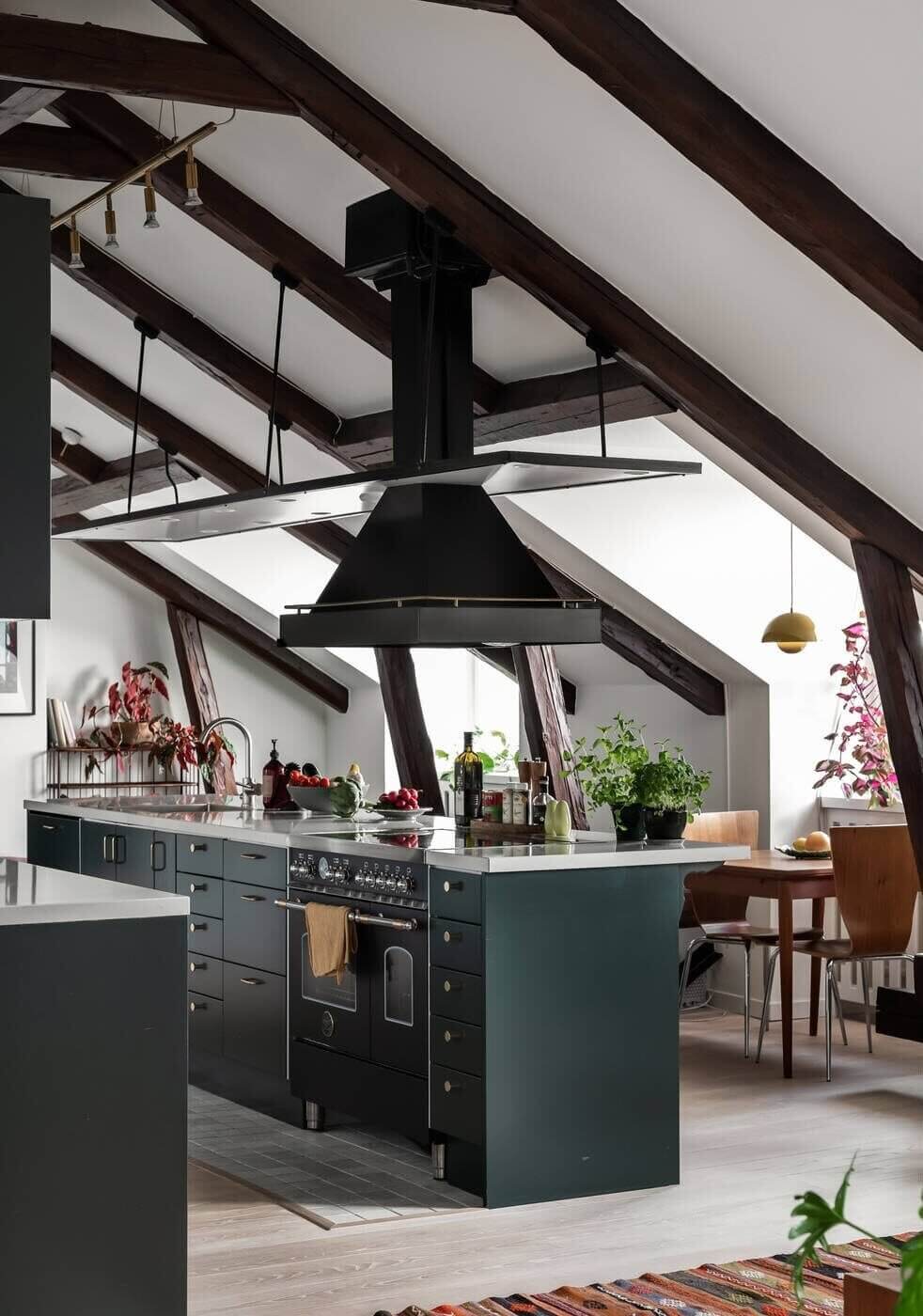A Scandinavian Penthouse Apartment With A Dark Green Kitchen 2 dark-green-kitchen-cabinets-kitchen-island-nordroom