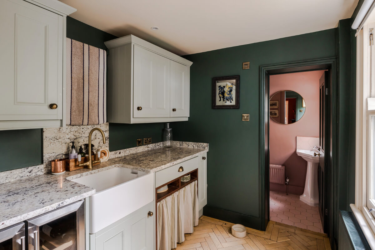 A Victorian Home with a Rich Color Palette and a Beautiful Garden 11 dark green utility room