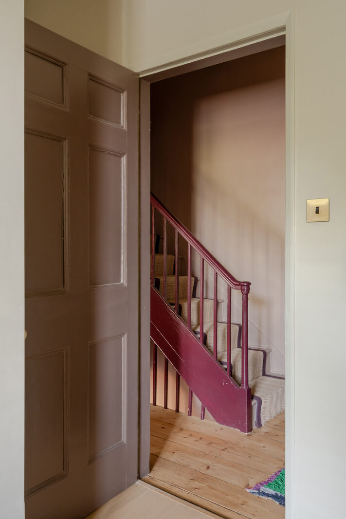 Vibrant Colors in a 19th-Century Regency Townhouse in England 28 dark pink staircase