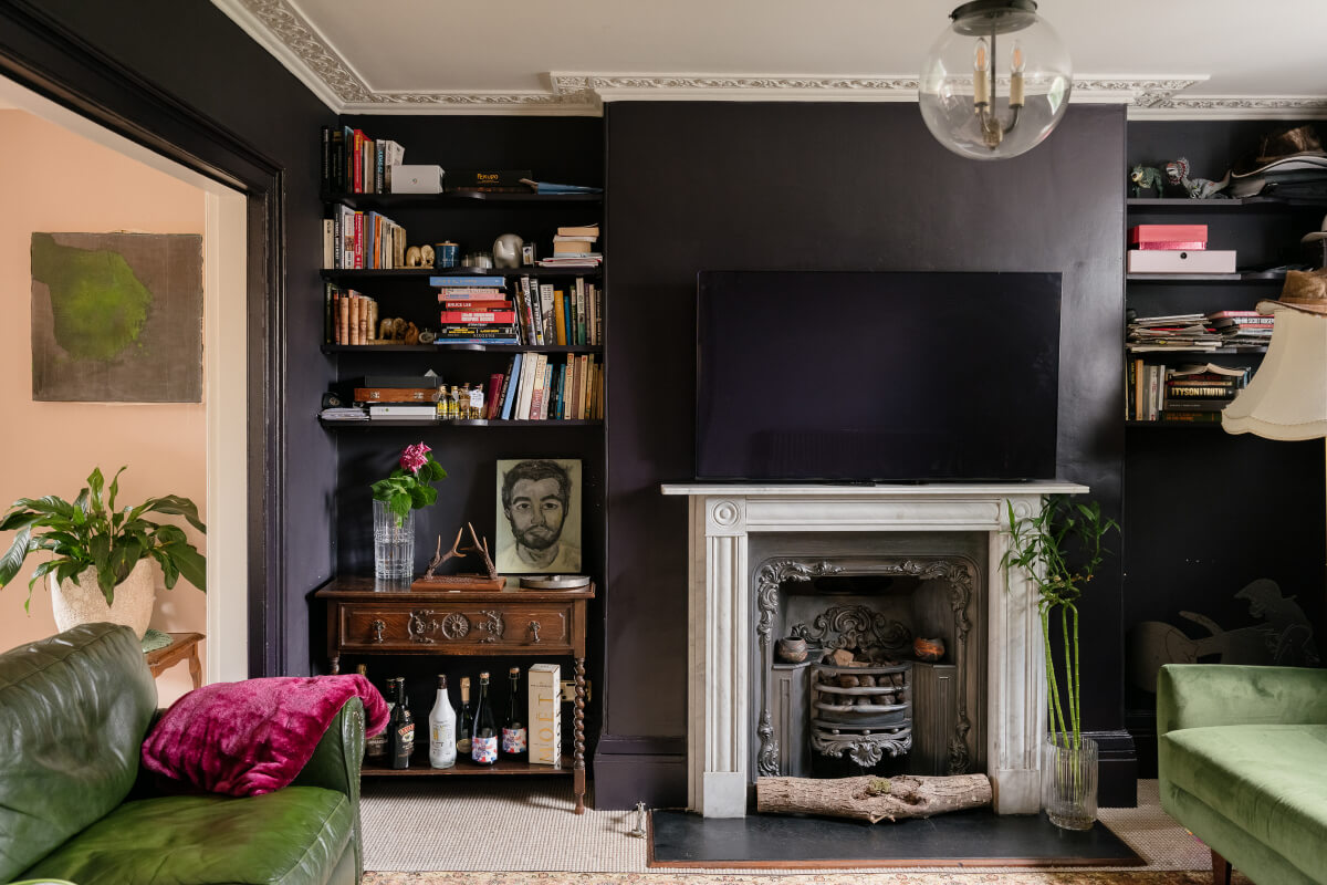 A Classic Georgian House in London with a Lush Garden 6 dark sitting room fireplace bookshelves