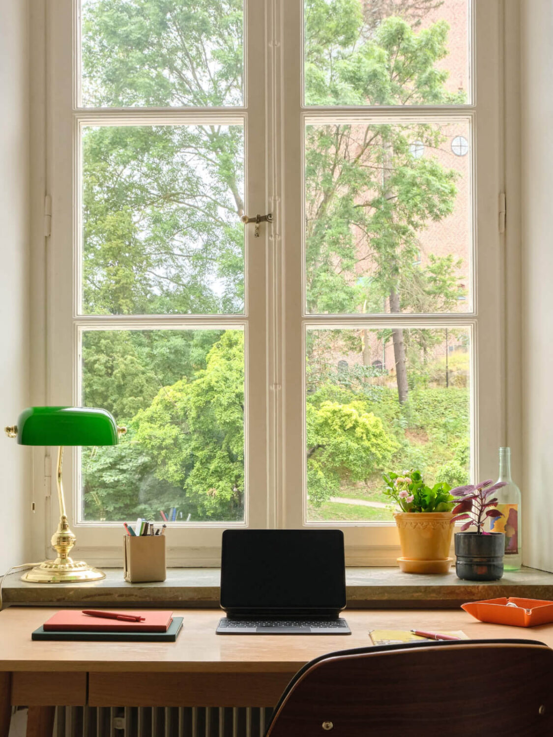 A Beautiful Color Palette and Historic Elements in a Stockholm Apartment 14 desk-under-window