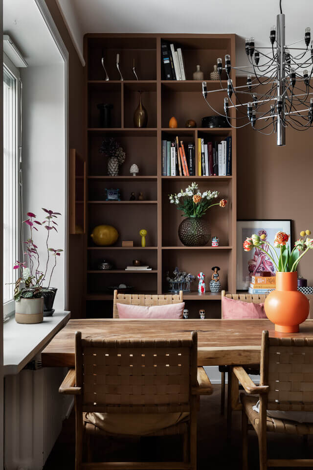 The Color Trends for 2025: Warm, Natural Shades and a Cheerful Accent 89 dining-room-brown-built-in-bookcases-walls-nordroom