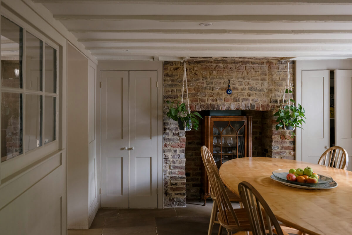 A Classic Georgian House in London with a Lush Garden 8 dining room exposed brick wall