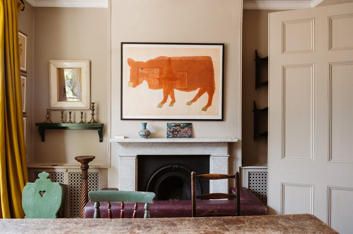 A Cozy Victorian House with Warm Color Accents 6 dining-room-fireplace-yellow-curtains-nordroom