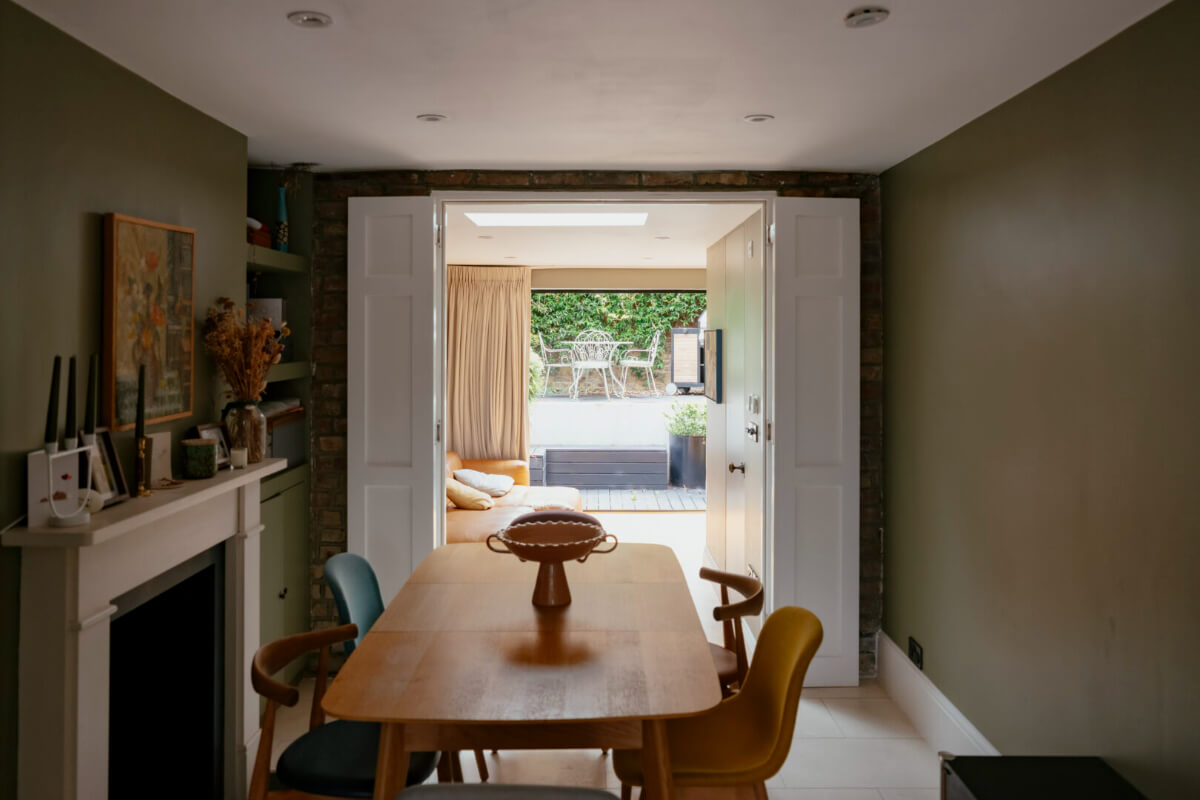 A Renovated Victorian Townhouse with a Small Split-Level Garden 14 dining room with double doors to sitting room