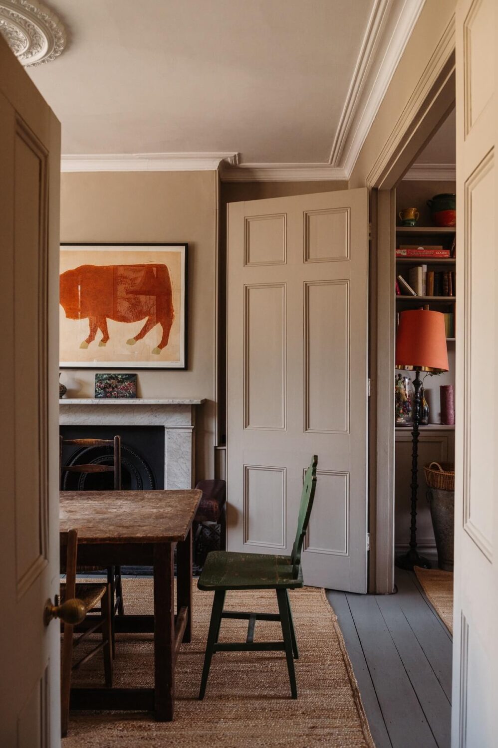 A Cozy Victorian House with Warm Color Accents 5 dining-room-wooden-table-fireplace-nordroom