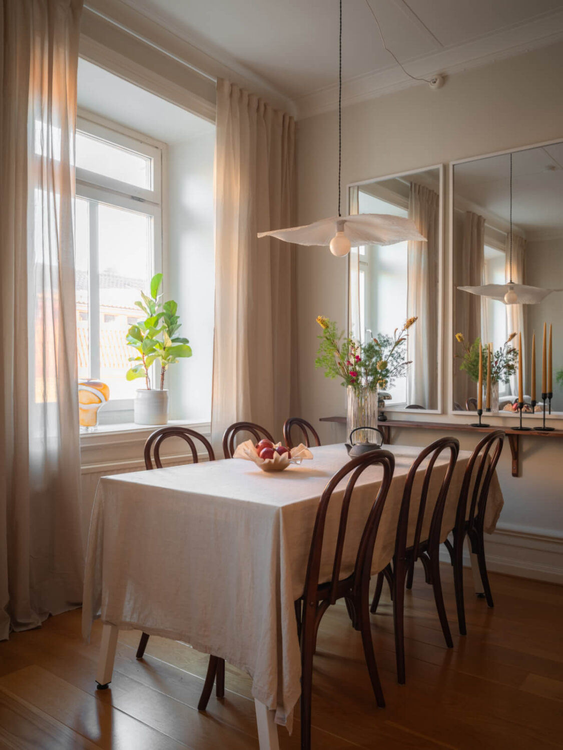 A 19th Century Apartment with a Dark Glass Room Divider 4 dining table shelf two mirrors
