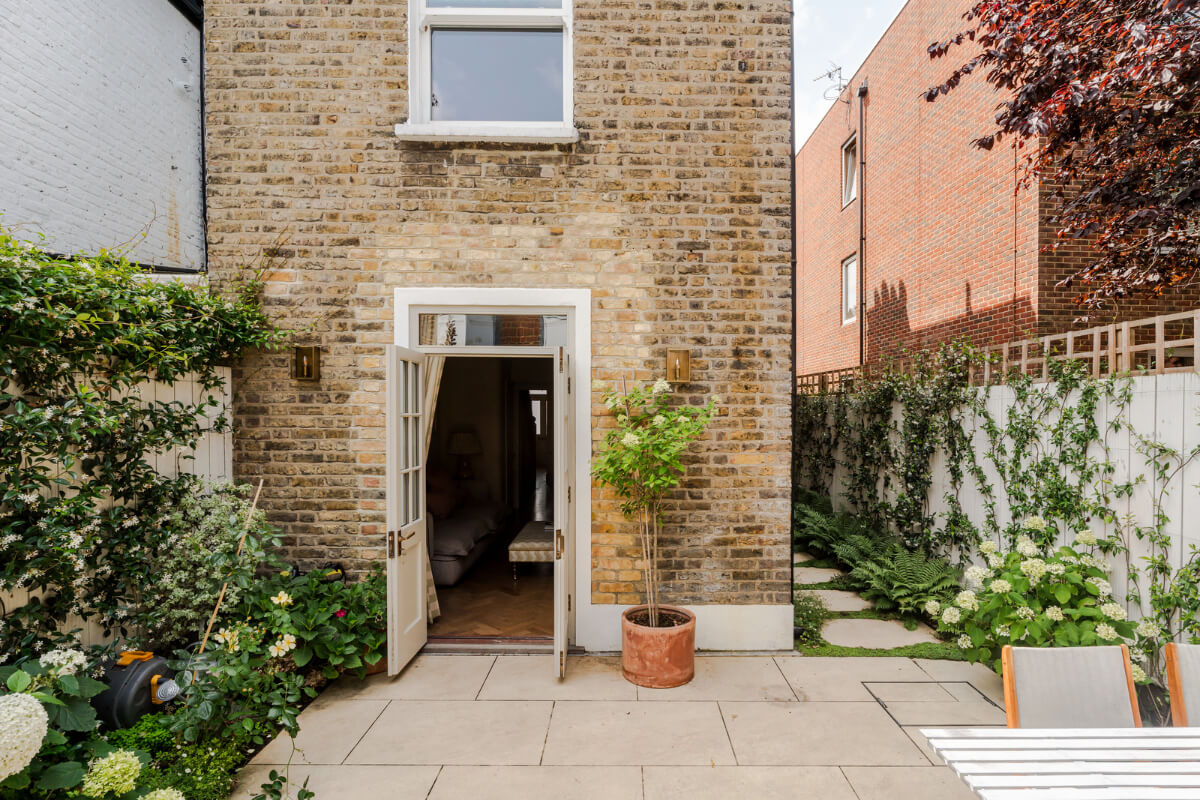 Color, Pattern, and Texture in a Renovated London Townhouse 28 double glass doors paved garden