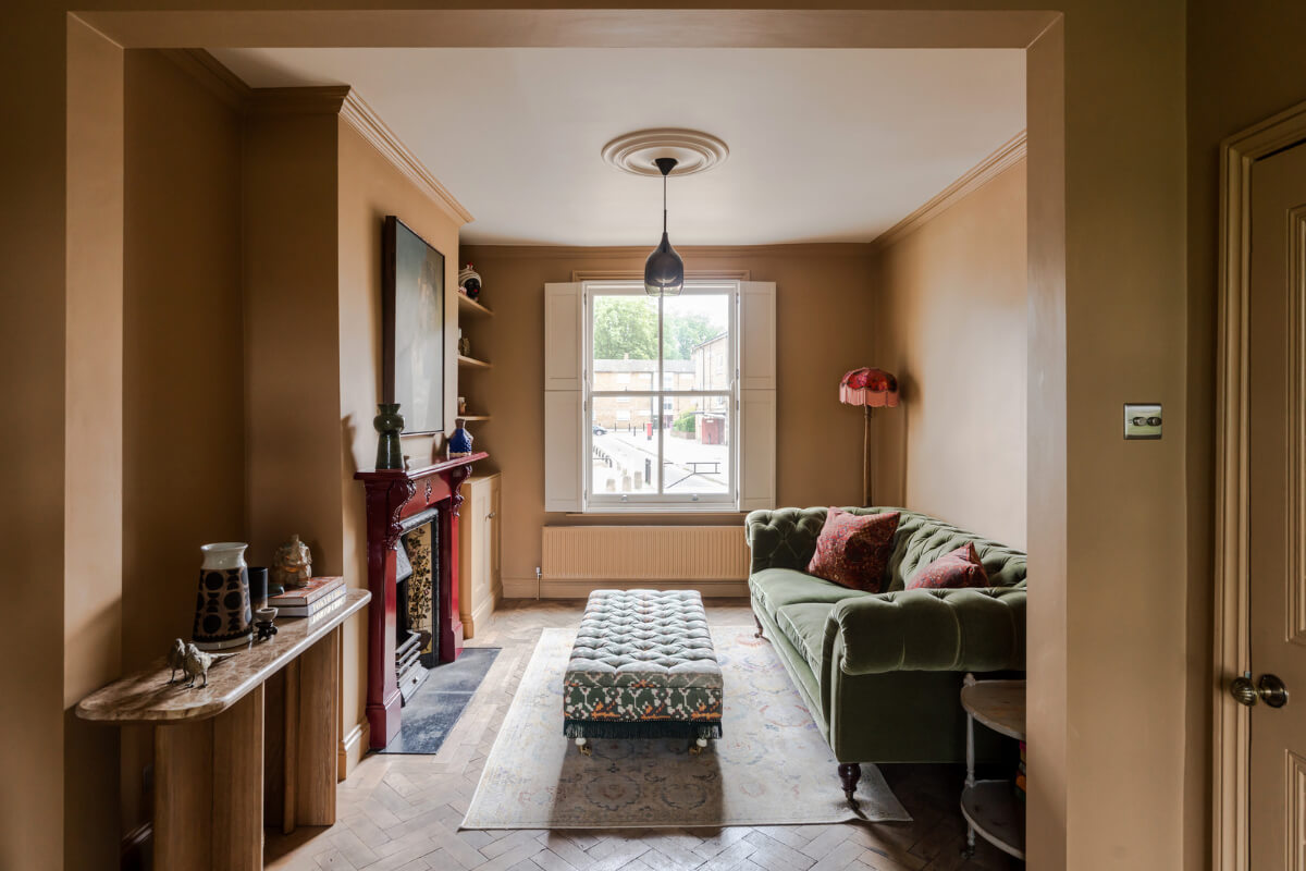 A Victorian Home with a Rich Color Palette and a Beautiful Garden 2 double living room golden walls