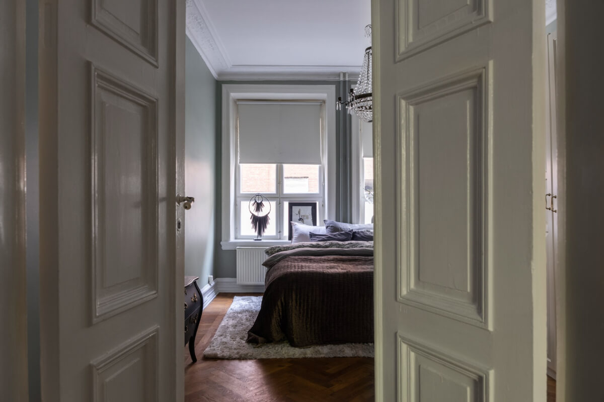 Classic Proportions and a Charming Kitchen in a Malmö Apartment 10 double wooden doors to bedroom