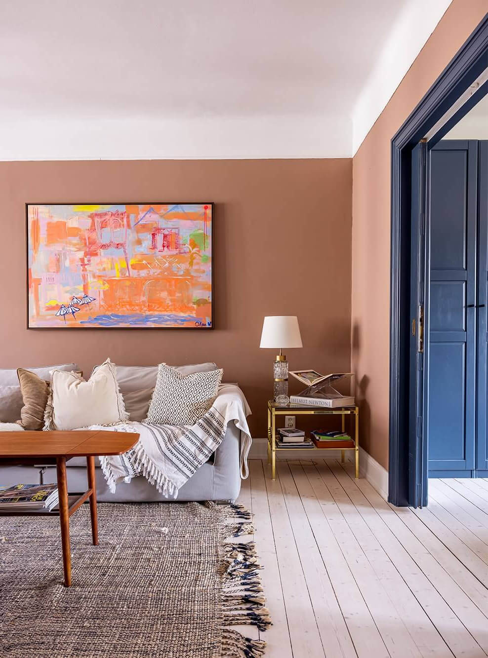 earthy pink walls and blue woodwork in a swedish apartment nordroom