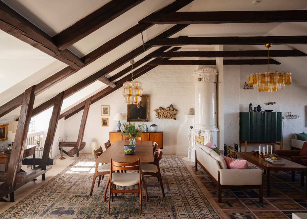 Revisiting a Spectacular Stockholm Penthouse with Exposed Beams 2 exposed beams fireplace swedish penthouse apartment