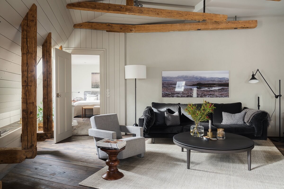 A Stylish Penthouse Apartment with Exposed Beams 3 exposed wooden beams living room gray tones