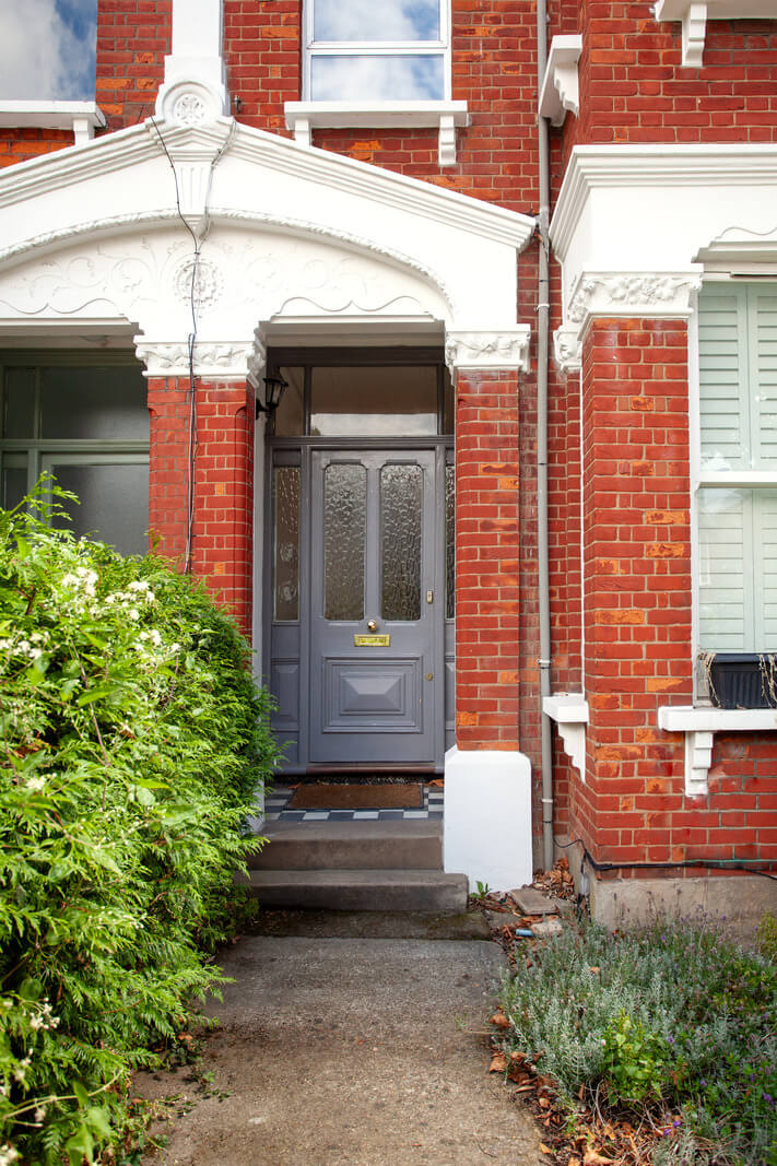 Pastel Tones and Midcentury Design in a Top Floor London Apartment 20 front door
