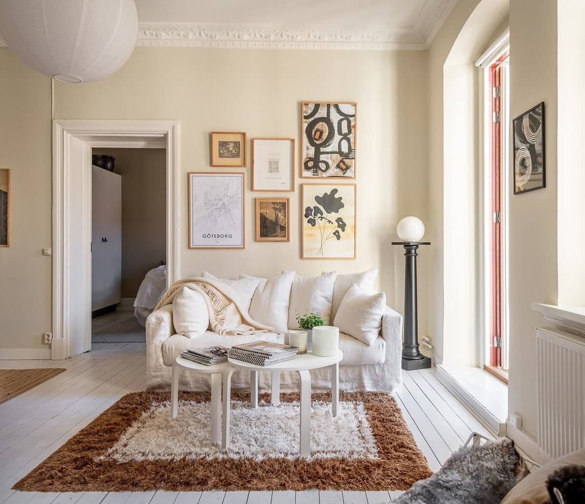 Warm, Neutral Colors in a Lovely Swedish Apartment 8 gallery wall beige paint living room nordroom