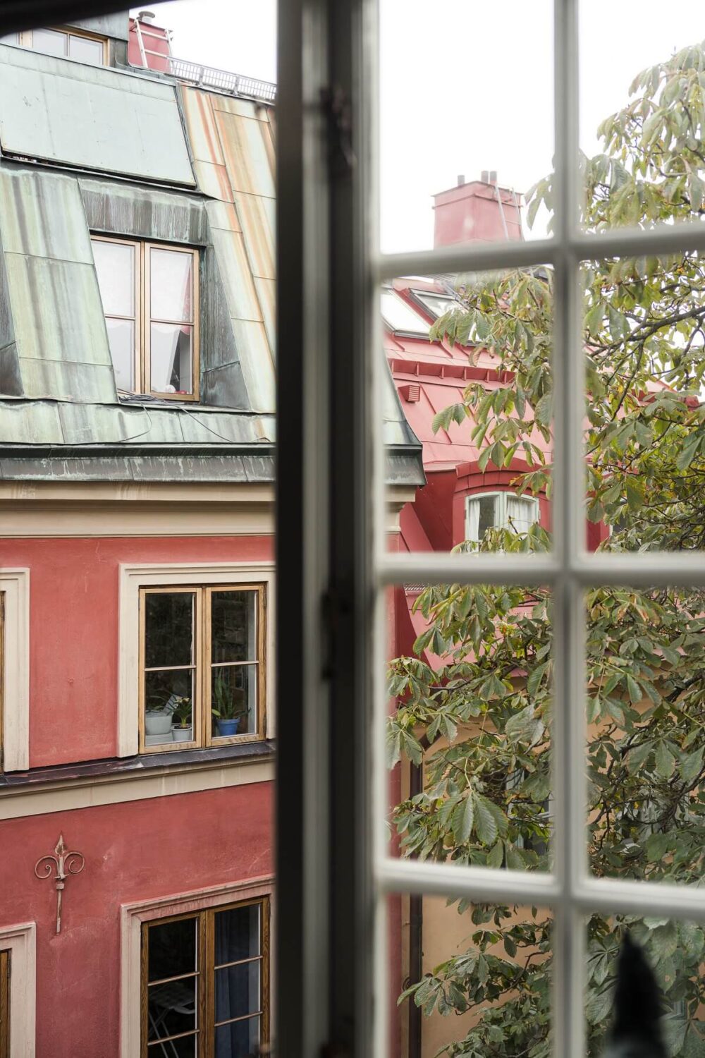 A Stylish Penthouse Apartment with Exposed Beams 33 gamla stan view from window