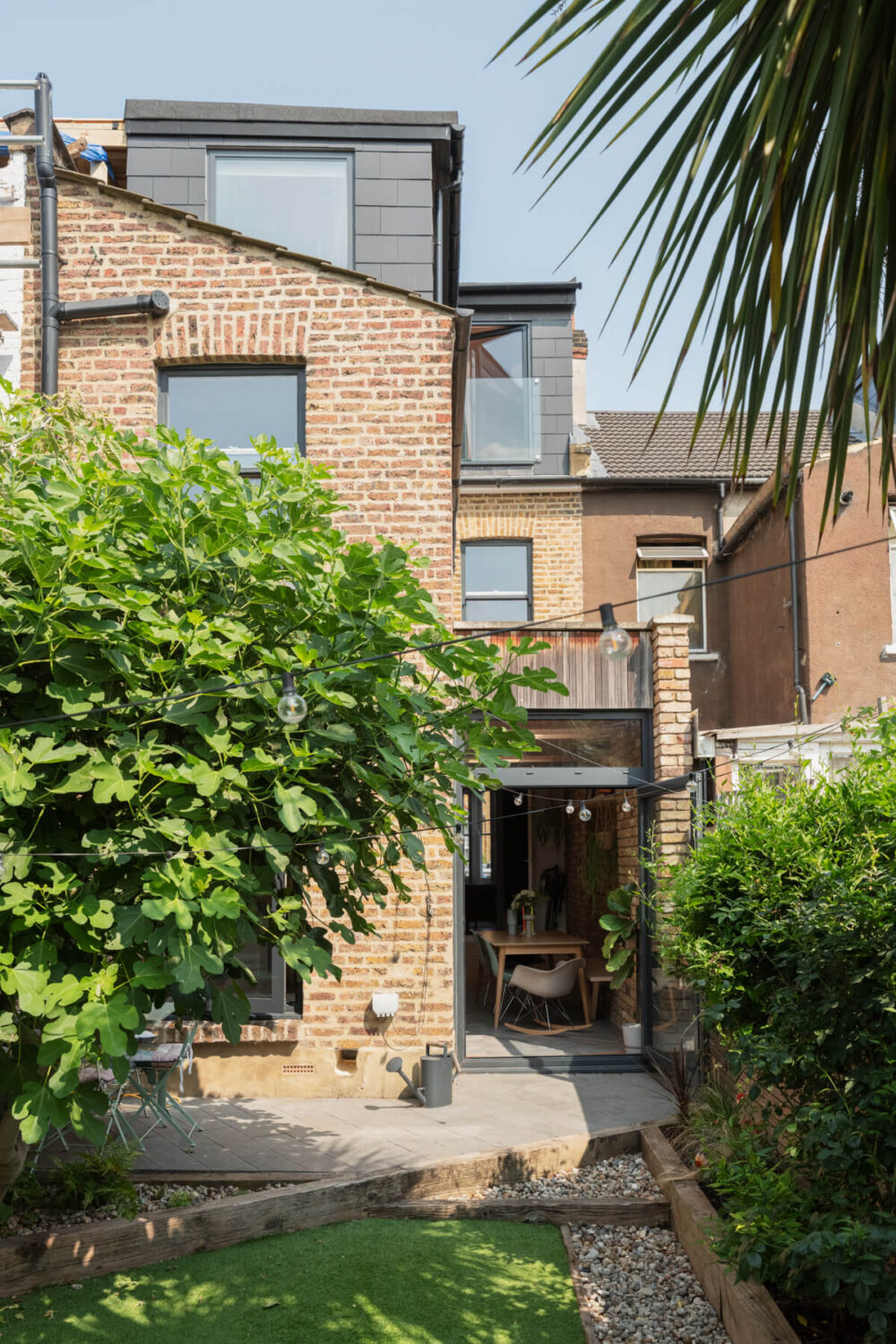 Exposed Brick and Wooden Beams in an Extended London Home 18 garden with kitchen extension