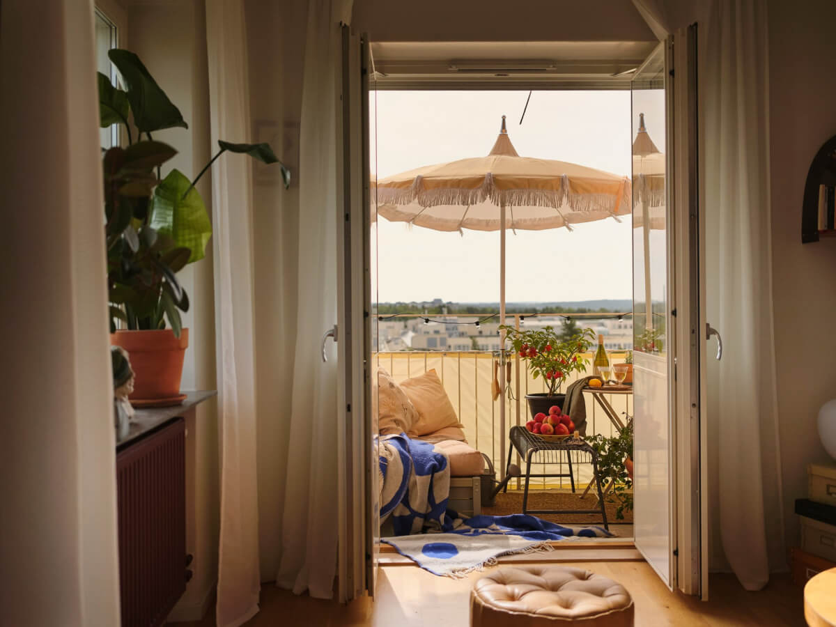 A 1940s Swedish Apartment with a Soft Yellow Kitchen 3 glass balcony doors