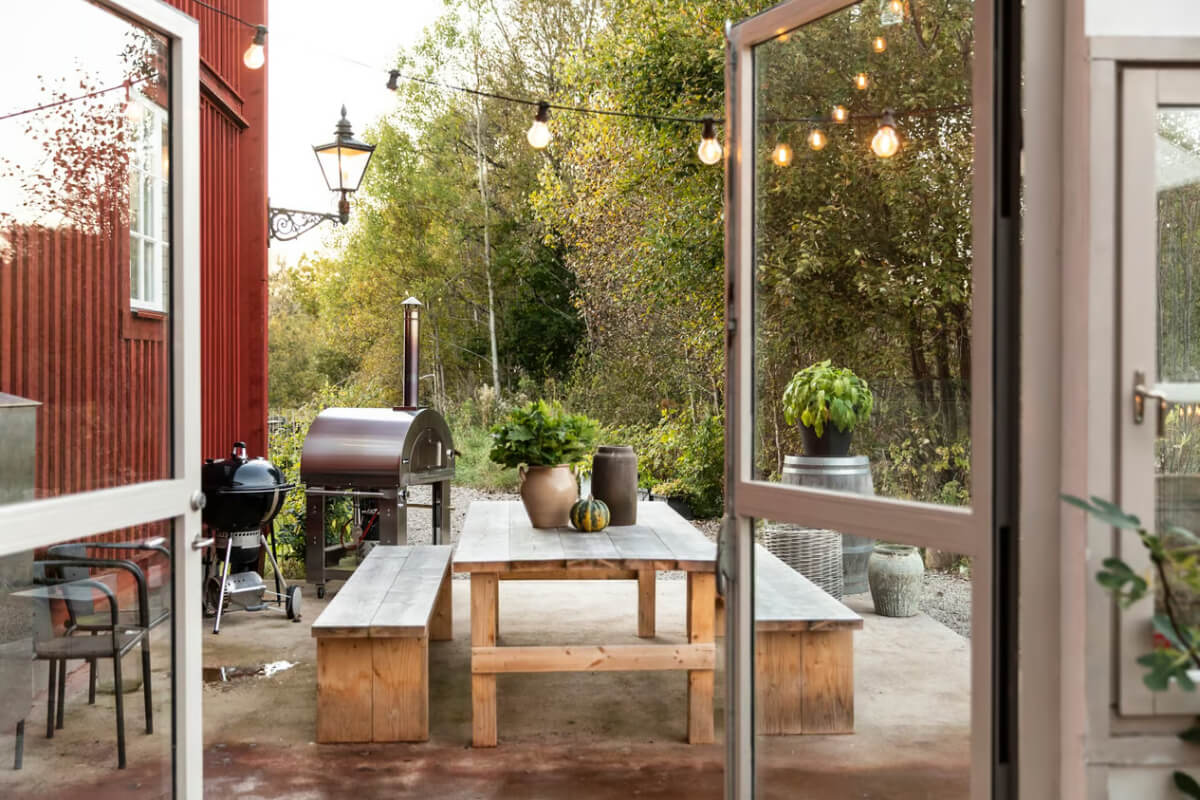 An Open-Plan Gray Home in a Former Textile Factory 21 glass doors to garden