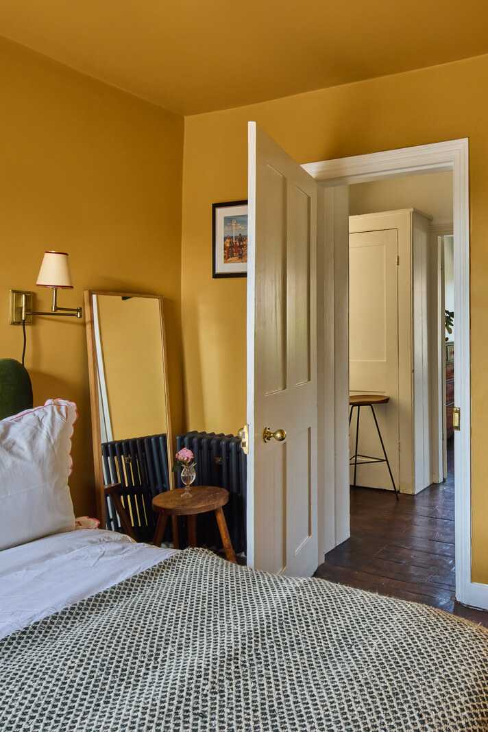 A 19th Century London Cottage with a Stunning Kitchen Extension 16 golden yellow walls ceiling bedroom